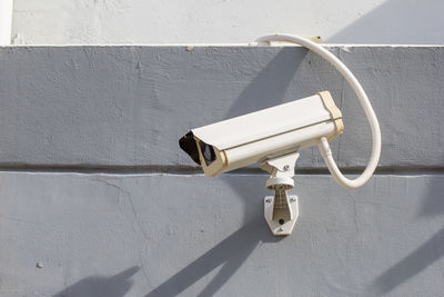 Close-up of electric lamp on wall