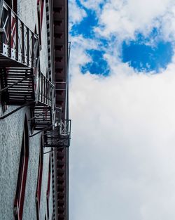 Low angle view of building against cloudy sky