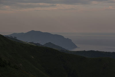 Scenic view of mountains against sky during sunset