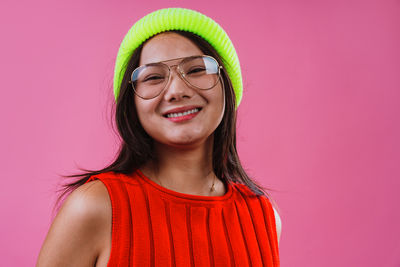 Portrait of young woman wearing hat