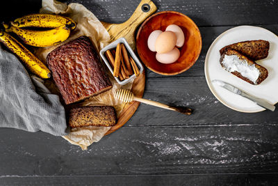 Home made banana bread rustic flat lay fresh ingredients honey eggs