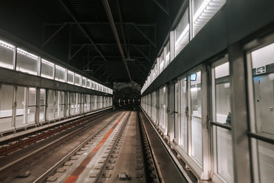 View of moving subway carriage between airport terminals.riding driverless metro train in barcelona
