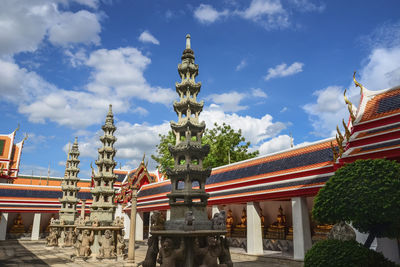 Panoramic view of temple building against cloudy sky