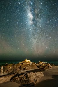Scenic view of sea against sky at night