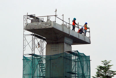 Low angle view of construction site against clear sky