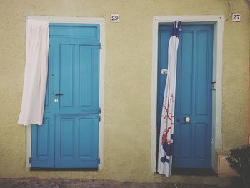 Closed blue door of building