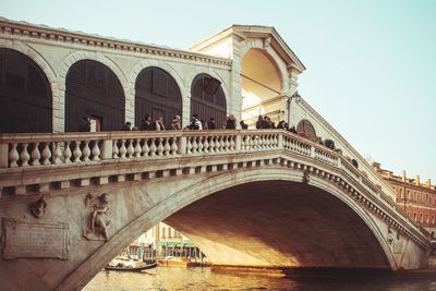 Low angle view of arch bridge against sky