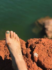 Close-up of hand on rock