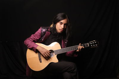 Young man playing guitar