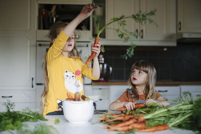 Sisters in kitchen