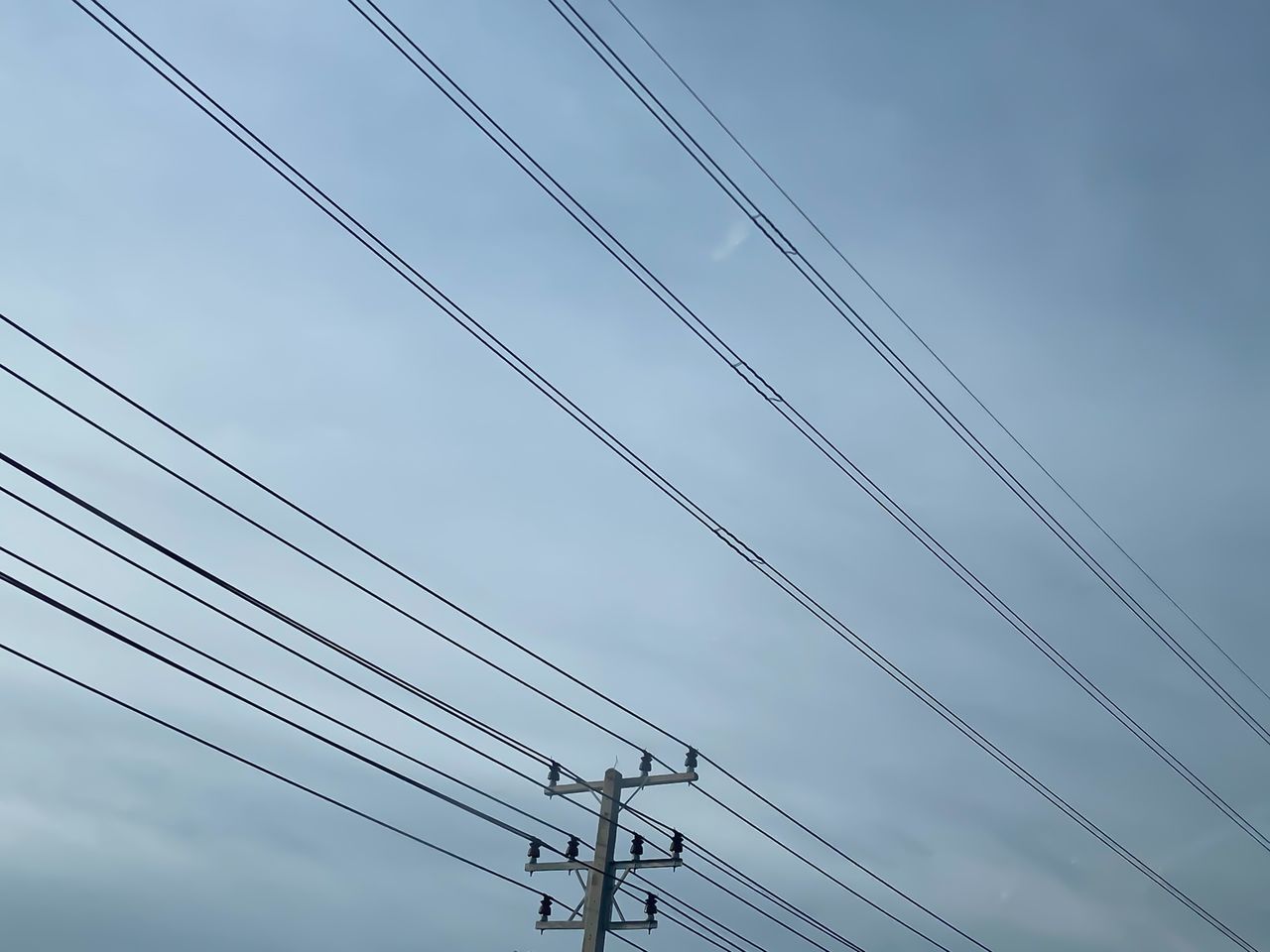 LOW ANGLE VIEW OF ELECTRICITY PYLONS AGAINST SKY