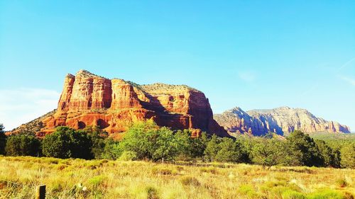 Low angle view of rock formation against sky