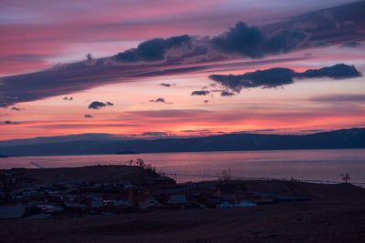 Scenic view of beach against sky during sunset