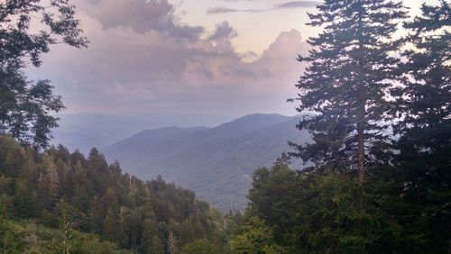 Scenic view of mountain against cloudy sky