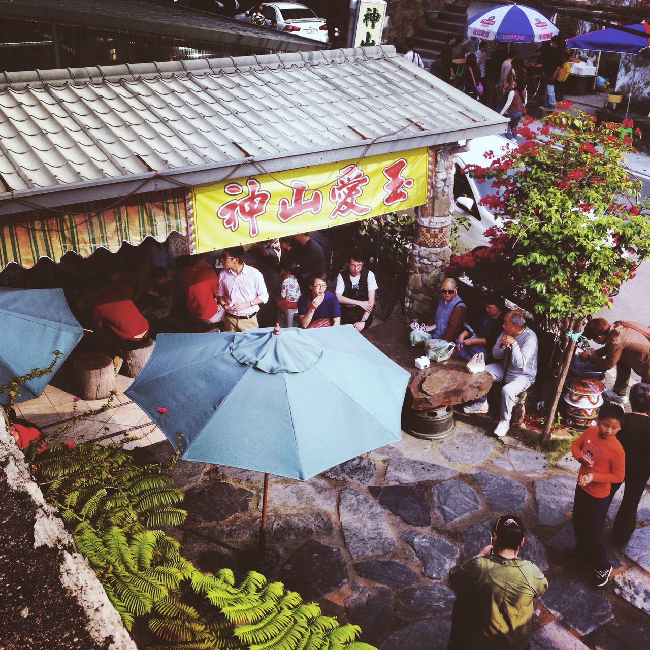 market, building exterior, built structure, retail, architecture, men, market stall, text, street, outdoors, lifestyles, for sale, person, store, tradition, city, cultures, religion, day