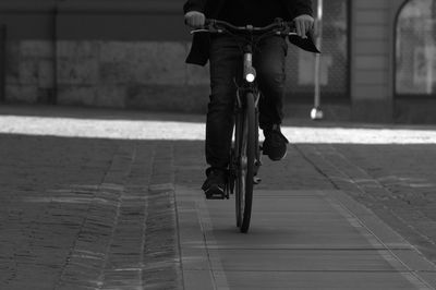 Low section of person walking on street