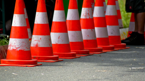 Close-up of traffic cones on road