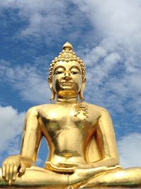 Low angle view of statue against sky