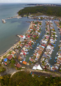 High angle view of sea and buildings in city