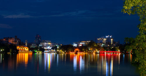 Illuminated buildings at hoan kiem lake hanoi city,vietnam.