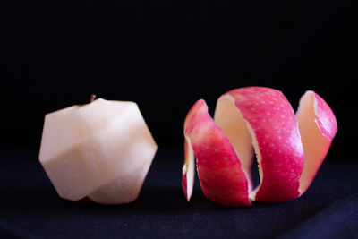 Close-up of cake against black background