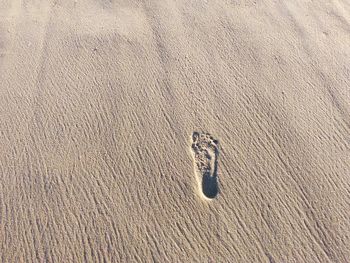 A footstep on beach sand