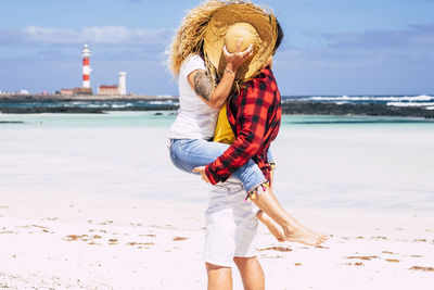 Full length of woman standing on beach