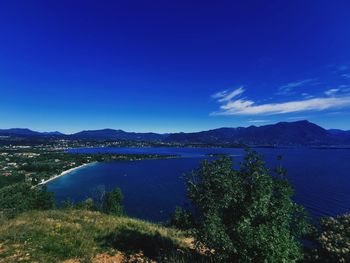 Scenic view of lake against blue sky