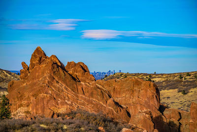 Scenic view of mountain against blue sky