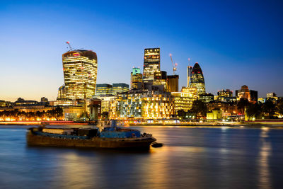 Illuminated buildings at waterfront