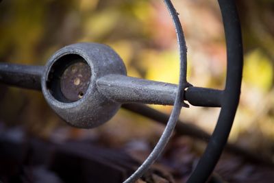 Close-up of abandoned car steering wheel