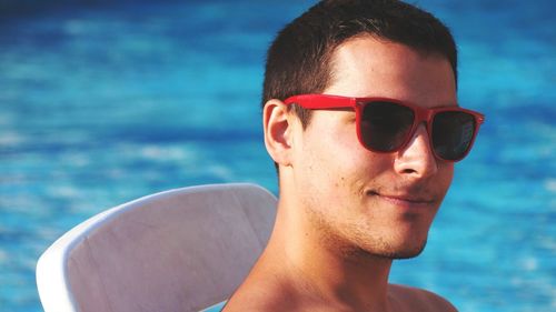 Portrait of young man wearing sunglasses