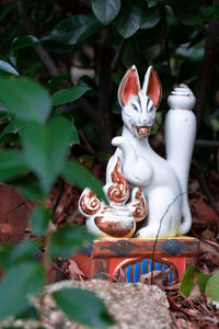 Close-up of statue against plants