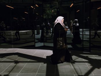 Woman standing in city