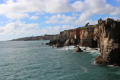 Scenic view of sea and cliff