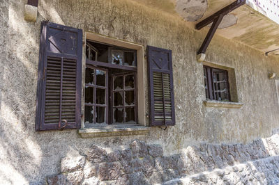 Low angle view of window on old building