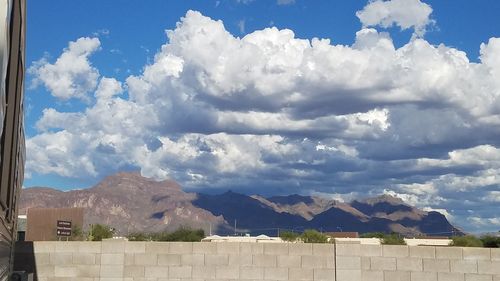 Scenic view of mountains against cloudy sky