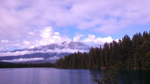 Scenic view of mountains against cloudy sky