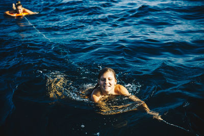 Portrait of young woman in sea