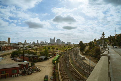 High angle view of street amidst buildings against sky