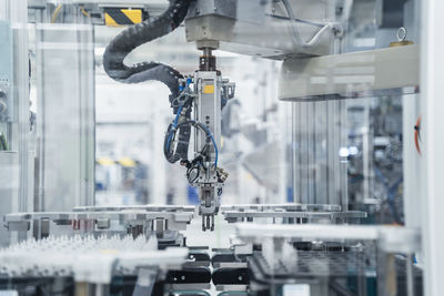 Arm of assembly robot functioning inside modern factory, stuttgart, germany