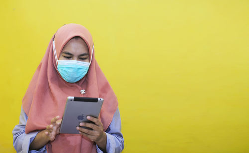 Young woman using mobile phone