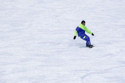 Full length of man skiing on snow