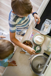 High angle view of boys preparing food