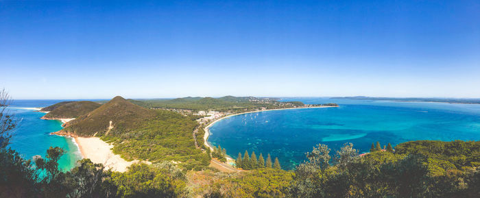 High angle view of bay against clear blue sky