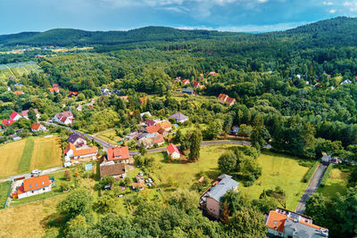 Village in mountains with forest, aerial view. mountain landscape