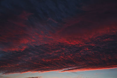 Low angle view of dramatic sky during sunset