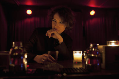 Woman enjoying a drink at a bar