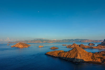 Scenic view of sea against clear blue sky