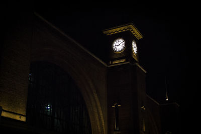 Low angle view of illuminated lights against sky at night